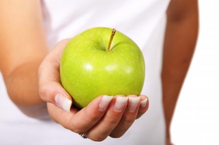 Green Apple in Woman Hand