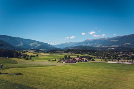 Green Grass Field Under Blue Sky