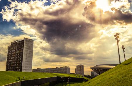 Green Grass Land Under Blue and White Cloudy Sky during Day Time