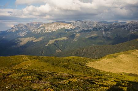 Green Mountain Range Under Cloudy Skies