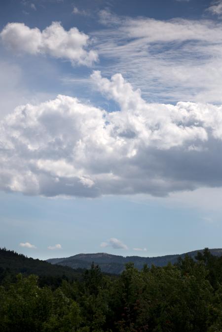 Green Mountain Under Cloudy Sky during Daytime