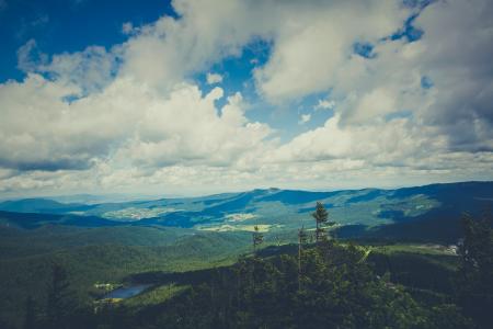 Green Mountain Under Cloudy Sky during Daytime