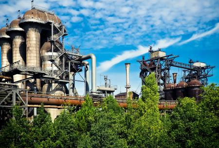 Green Trees Outside Factory Under Stratus Clouds