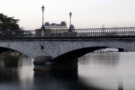 Grey Bridge With Light Post Under White Sky during Daytime