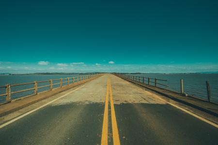 Grey Concrete Road in the Middle of the Sea