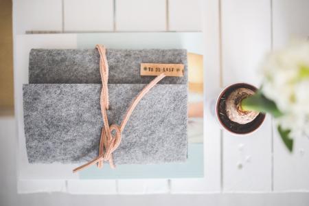 Grey Felt Journal TO DO LIST on a white desk