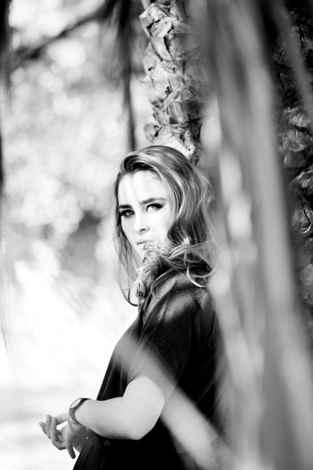 Grey Scale Photography of Woman Leaning