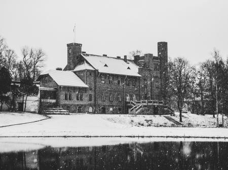 Greyscale Photo of Concrete House Covered With Snow