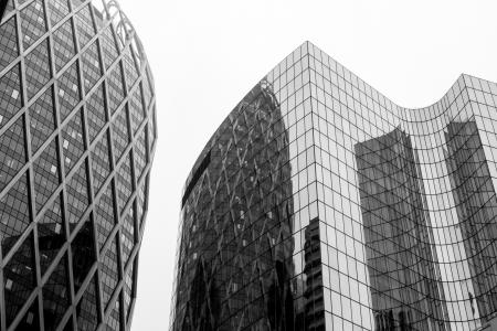 Greyscale Photo Of Glass Window Buildings