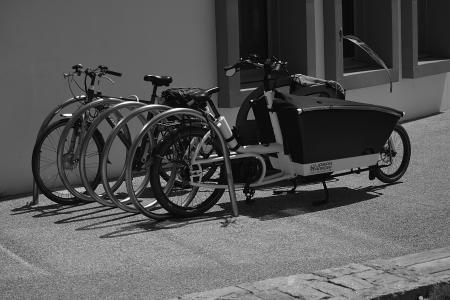 Greyscale Photo of Utility Bike during Daytime