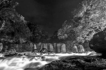 Greyscale Photo of Waterfall during Nighttime