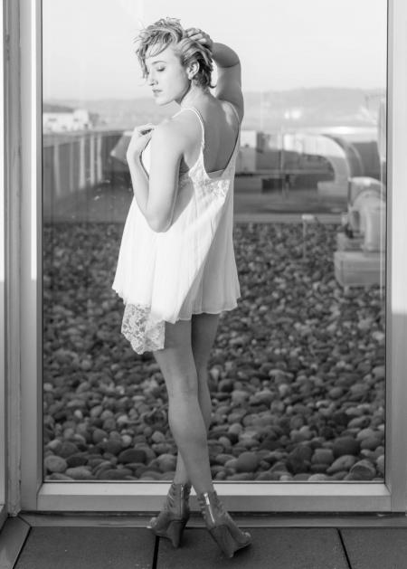 Greyscale Photograph of Woman Wearing Spaghetti Strap Mini Dress While Standing