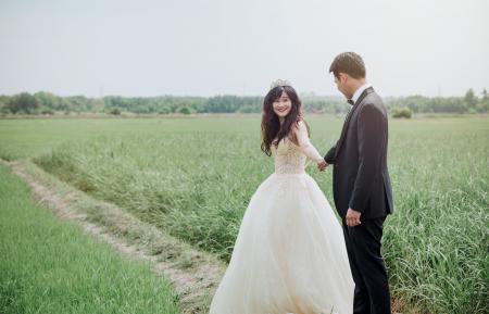 Groom and Bridge Along Hallway at Daytime