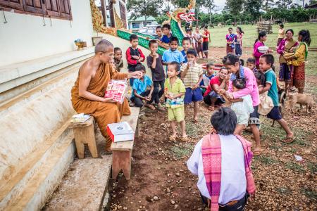 Group of Children in Front of Monk at Daytime