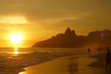 Group of People on Seashore during Sunset