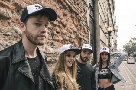 Group of People Wearing Fitted Caps Beside Road