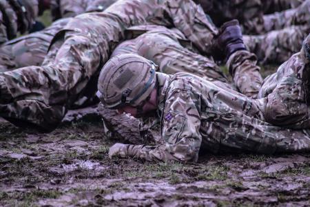 Group of Soldiers Crawling on Mud