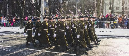 Group of Soldiers Parading on Concrete Road