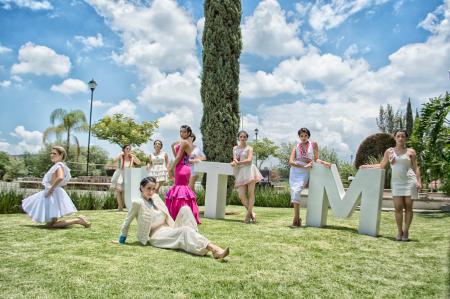 Group of Woman on Green Grass Field