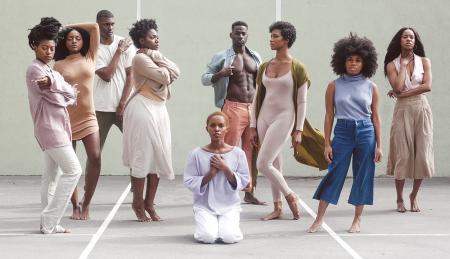 Group of Women and Men Standing on Gray and White Concrete Floor