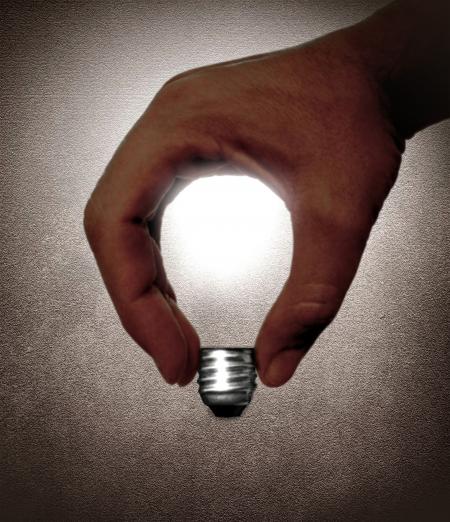 Hand and lightbulb - Creativity and idea