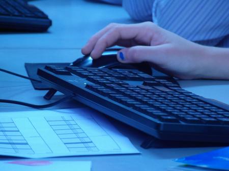 Hand on Computer Mouse