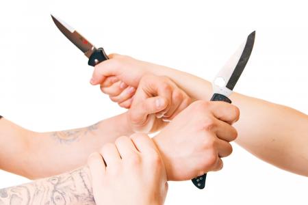 Hands with knives