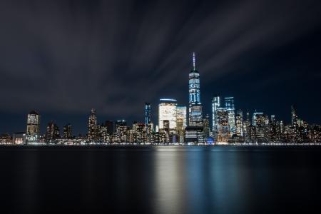 High-rise Buildings at Night Near Sea