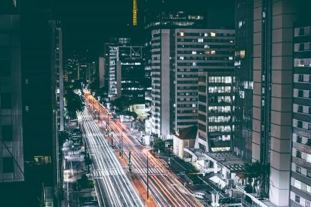 High Rise Buildings Beside Road during Nighttime