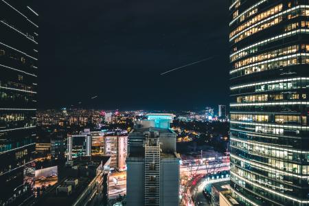 High Rise City Building during Night Time Photo