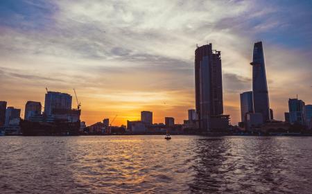 High-rise Building in Front of Body of Water during Sunset