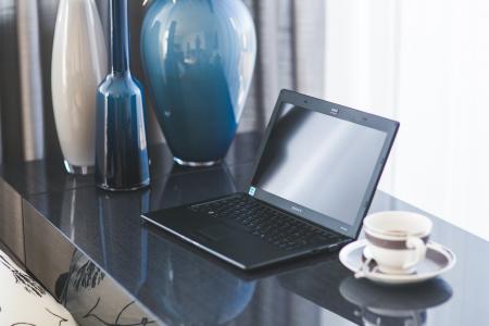 Home office desk with laptop and coffee