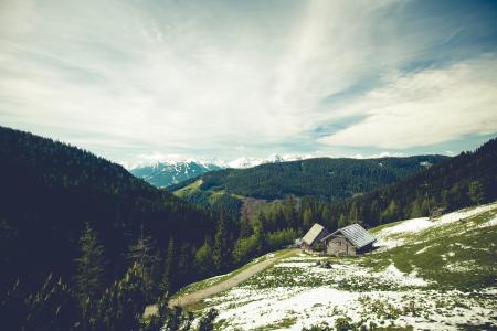 House Beside the Mountain Under White Sky during Daytime