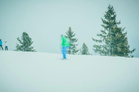 Human in Blue Pants Riding Ski Board