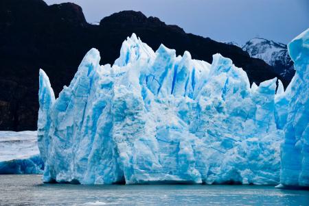 Ice Burg Floating on Water during Daytime