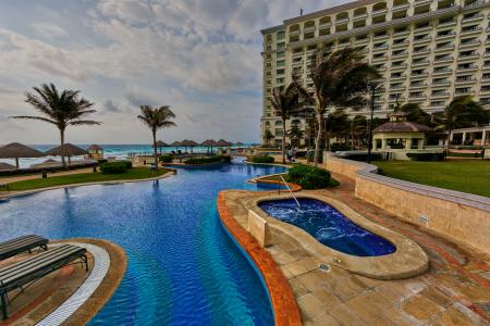 In-ground Pool Near Building during Daytime