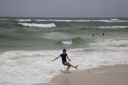 Kid Playing with the Wave