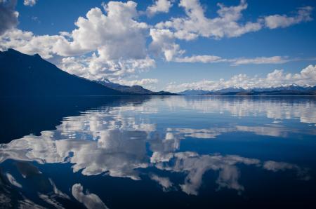 Lake Water Under White and Blue Skies during Daytime