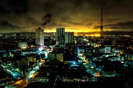 Landscape Painting of High Rise Building Under Brown Sky