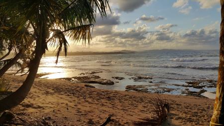 Landscape Photo of Beach Under Partly Cloudy Skies