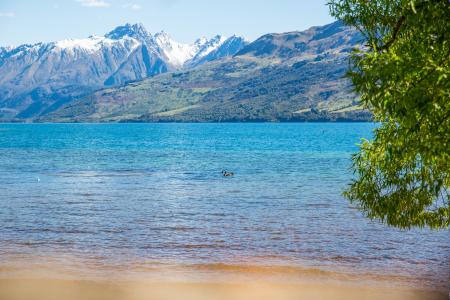 Landscape Photo of Body of Water With Mountain As Background