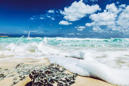 Landscape Photography of Beach With Raging Waves Under Clear Skies
