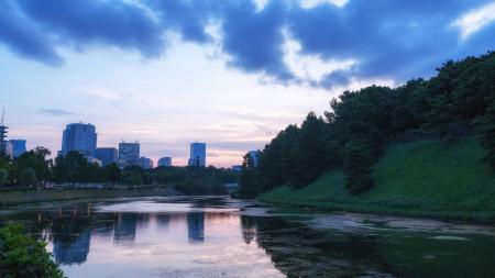 Landscape Photography of Body of Water and Green Hills