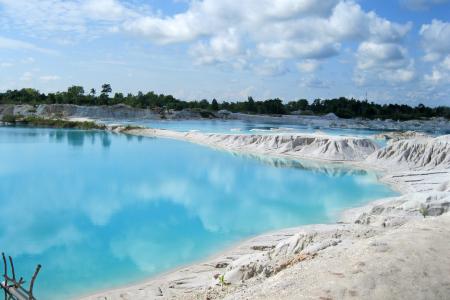 Landscape Photography of Body of Water Under Cloudy Sky