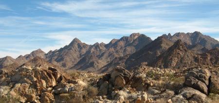 Landscape Photography of Brown Mountain Under White and Blue Cloudy Sky during Daytime