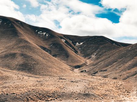 Landscape Photography Of Mountain Under White Clouds