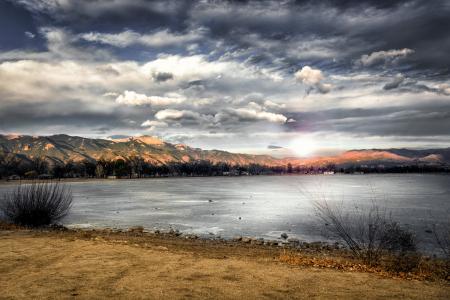 Landscape Photography of Mountains Near Body of Water