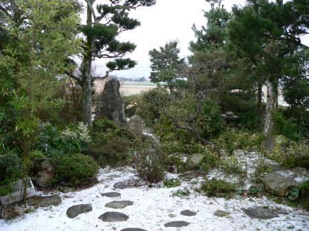 Light snowfall in a Japanese garden