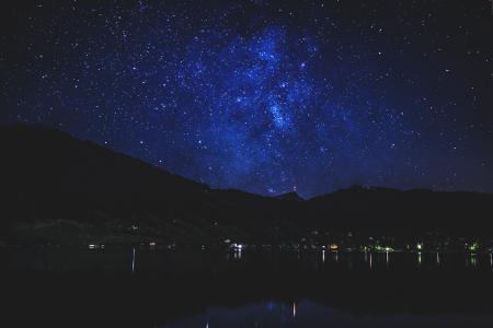 Lighted Building Near Body of Water at Nighttime