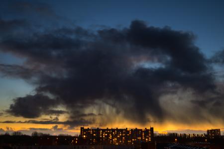 Lighted High Rise Building Under Blue Clouding Sky during Sunset